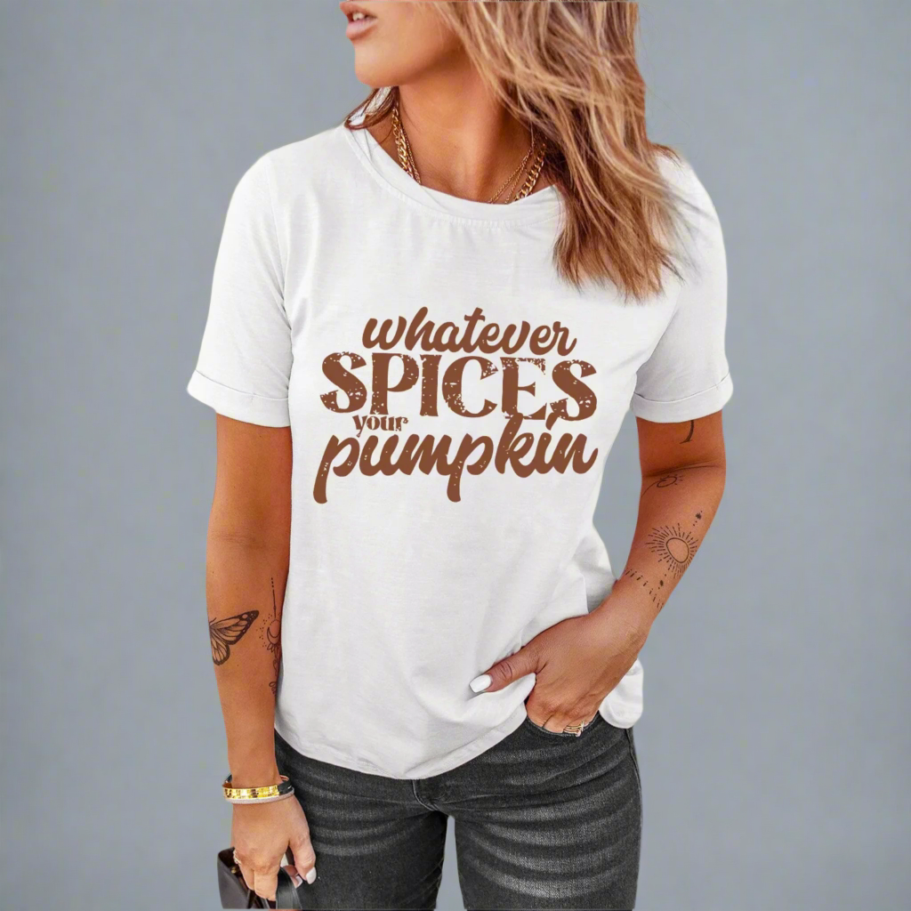 White t-shirt with 'whatever spices your pumpkin' text worn by a person on a gray background